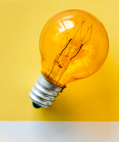 Colorful light bulb on a paper